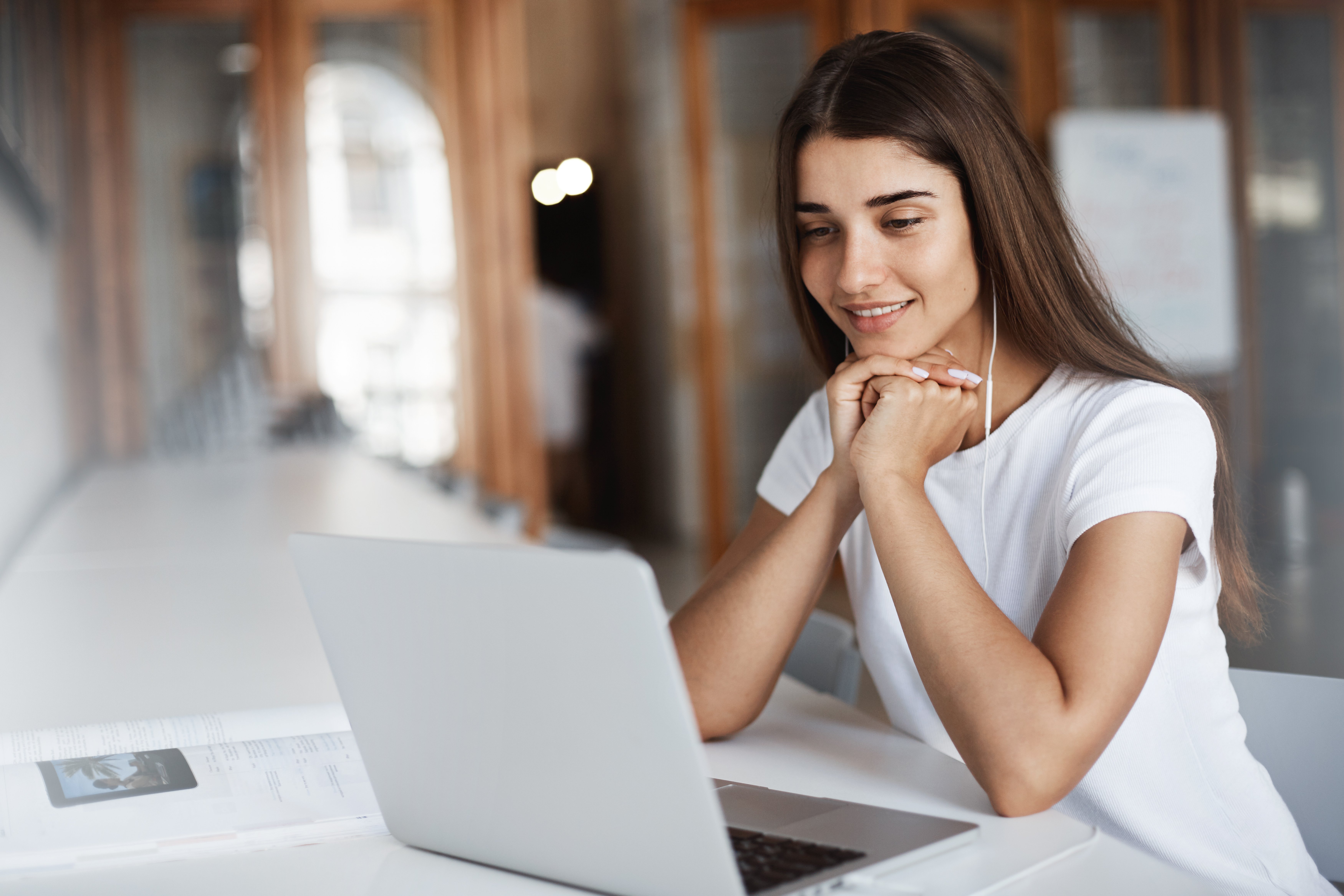 student-using-laptop-computer-call-parents-abroad-young-woman-using-notebook-listen-watch-movie